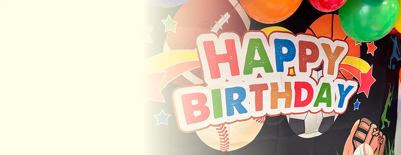 An image of a colorful Happy Birthday banner with sports-themed decorations