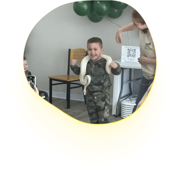 An image of a boy enjoying special events and workshops.